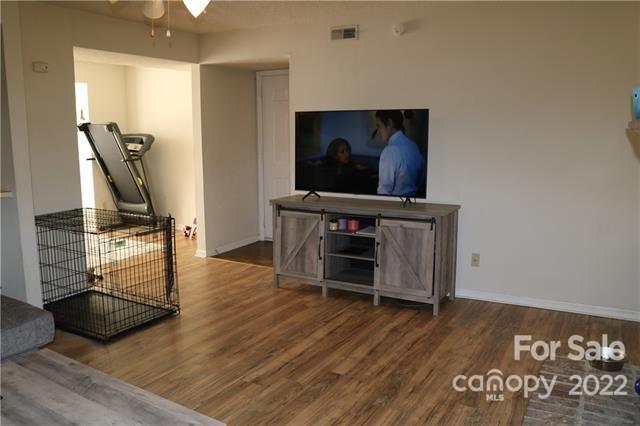11007 Running Ridge Road Charlotte, NC 28226 - Photo 8 of 38 a view of a workspace with furniture and wooden floor
