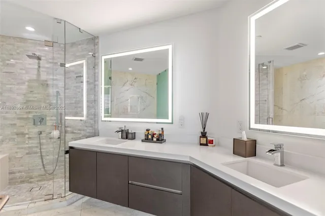 a bathroom with a double vanity sink mirror and double