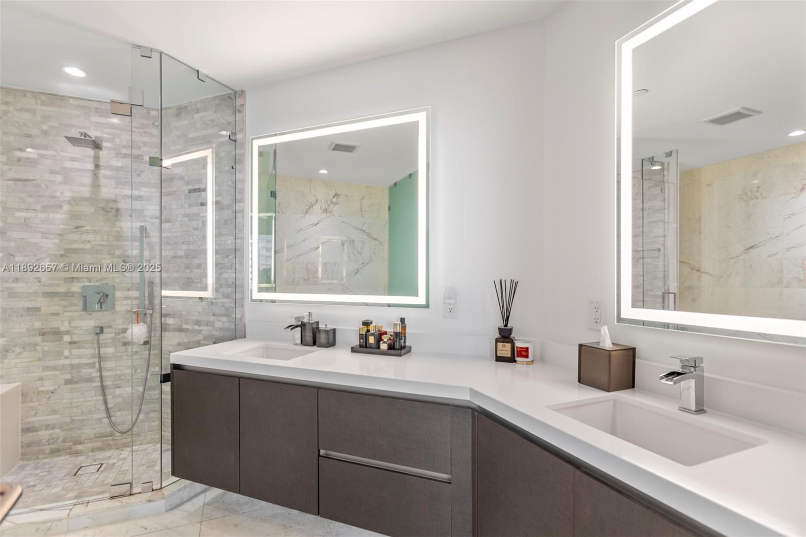 851 Northeast 1st Avenue, Unit 3707 Miami, FL 33132 - Photo 13 of 28 a bathroom with a double vanity sink mirror and double