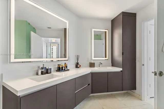 a bathroom with a sink double vanity mirror and a
