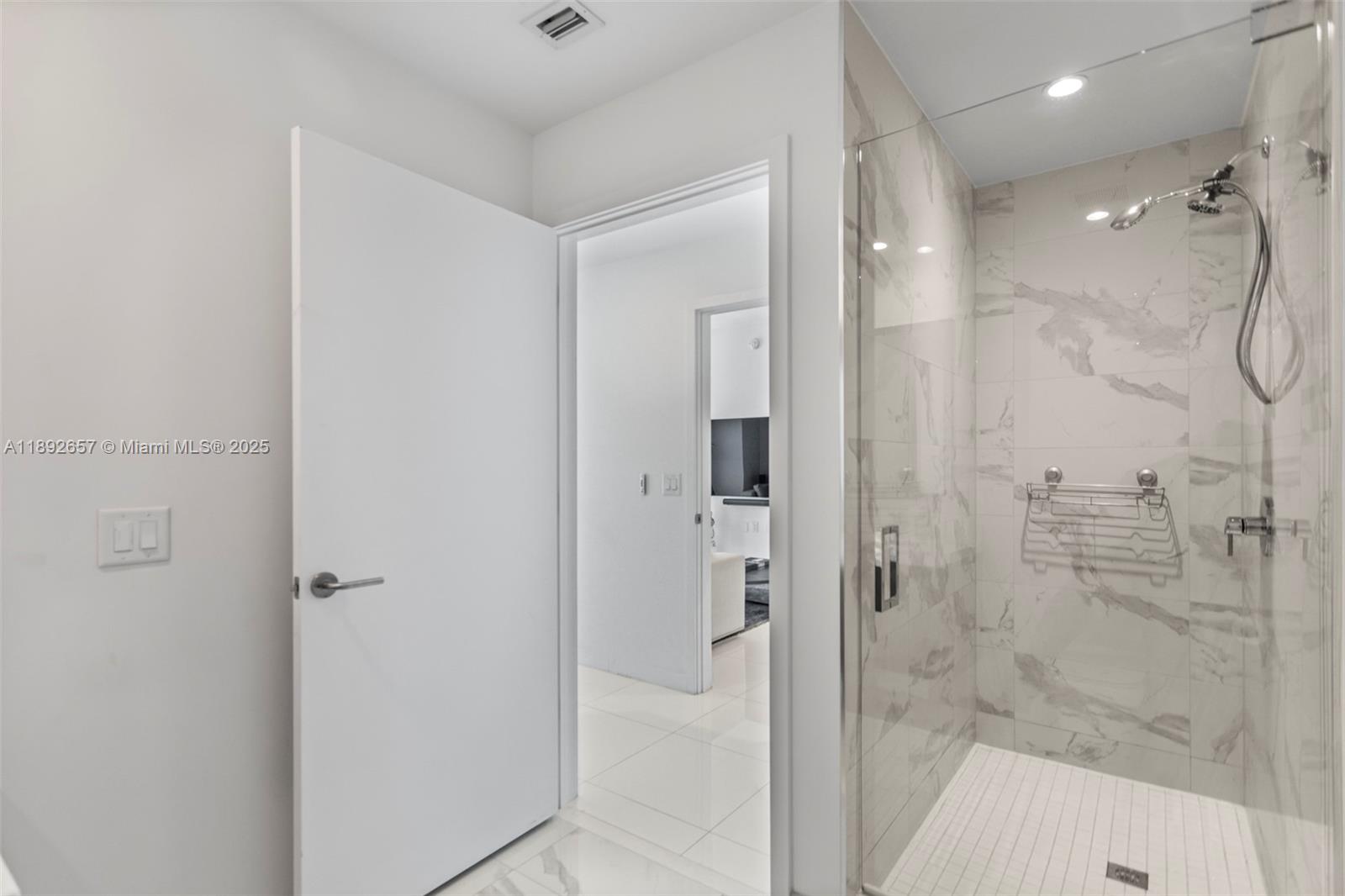 851 Northeast 1st Avenue, Unit 3707 Miami, FL 33132 - Photo 19 of 28 a bathroom with a shower
