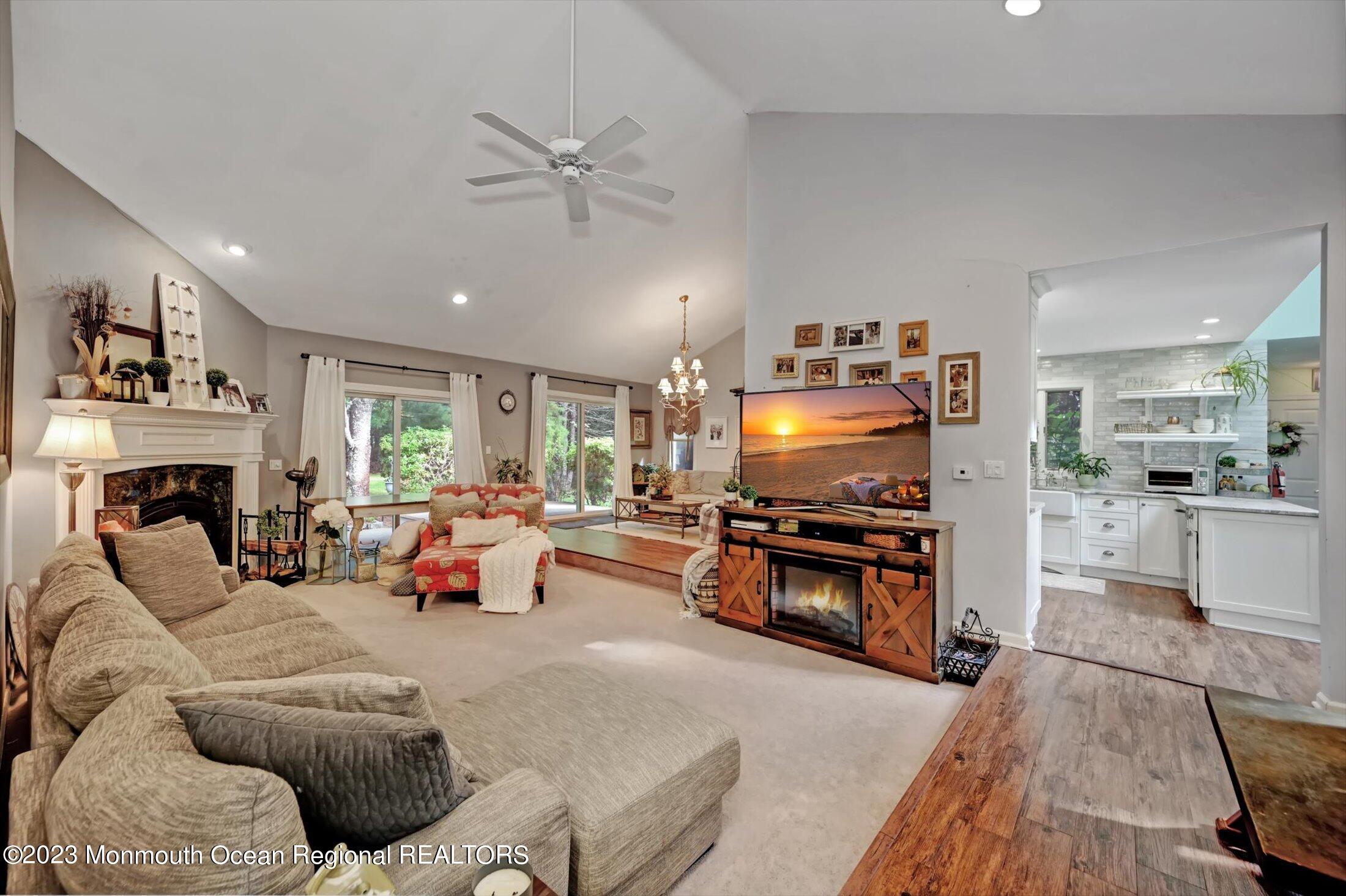 897 Fort Plains Road Howell, NJ 07731 - Photo 1 of 35 a living room with furniture and a flat screen tv