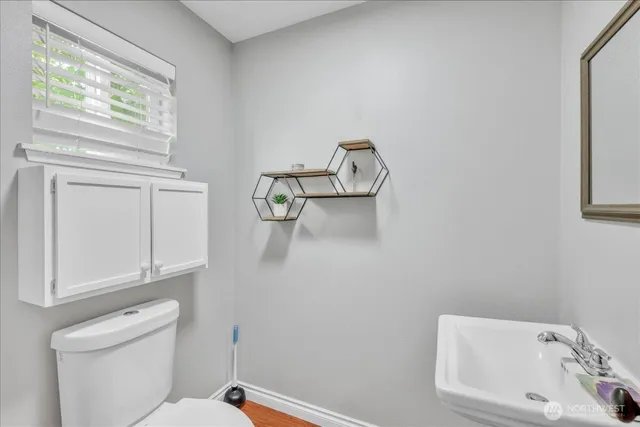 a bathroom with a toilet and a sink