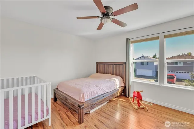 a bedroom with a bed and a window