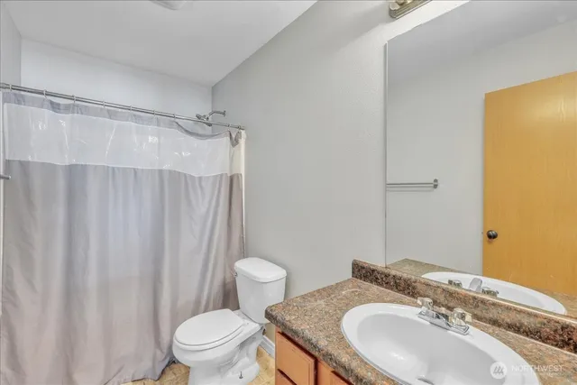 a room with wooden floor and lamp