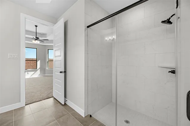 a bathroom with a shower and a sink