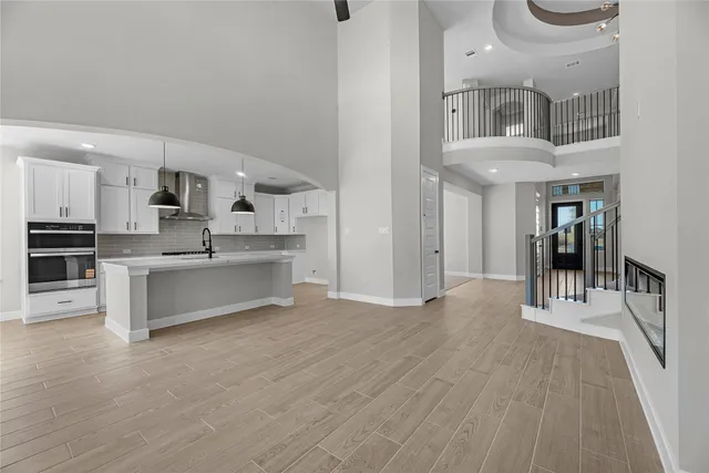 a view of kitchen with sink microwave and refrigerator