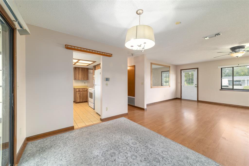 8954 Southwest 101st Place Ocala, FL 34481 - Photo 13 of 42 a view of a room with window and wooden floor