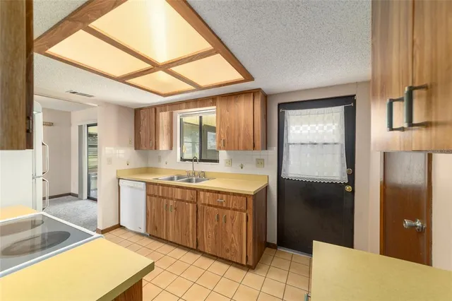 a spacious bathroom with a tub sink and mirror