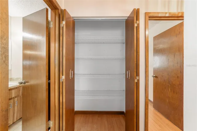 a bathroom with a glass shower door