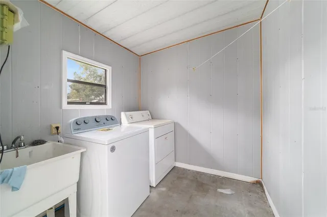 a utility room with dryer and washer