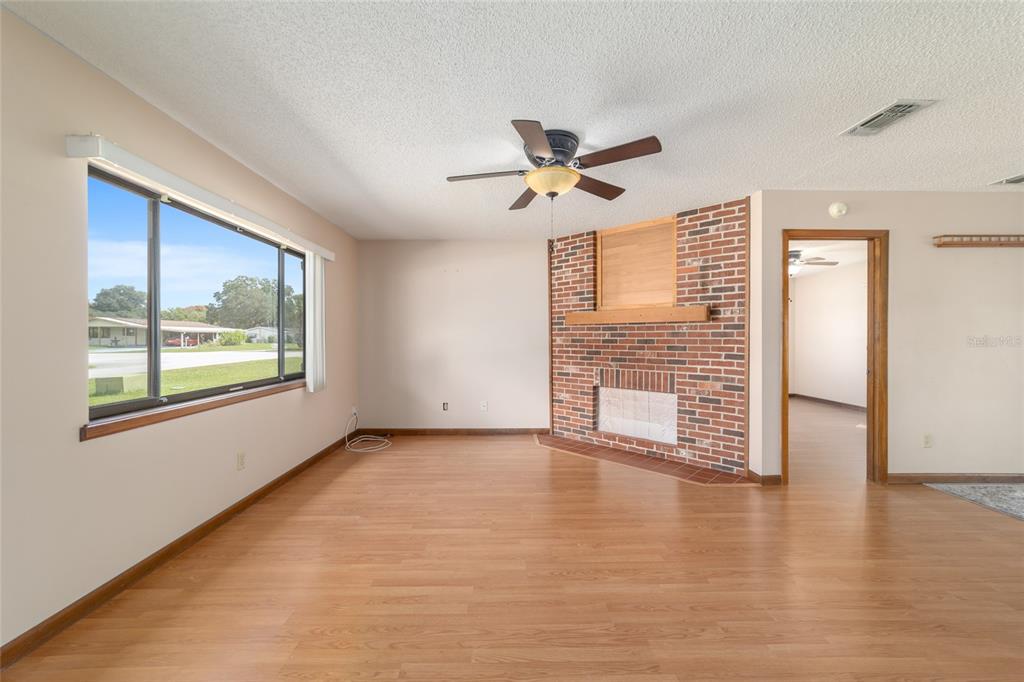 8954 Southwest 101st Place Ocala, FL 34481 - Photo 8 of 42 a view of an empty room with a window