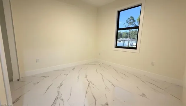 a view of a kitchen with a refrigerator cabinets and a window