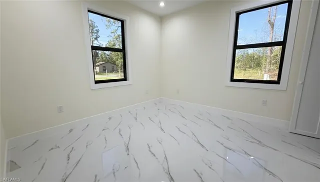 a kitchen with a sink a refrigerator a microwave a sink and cabinets