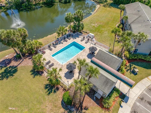 an aerial view of a house with a lake view