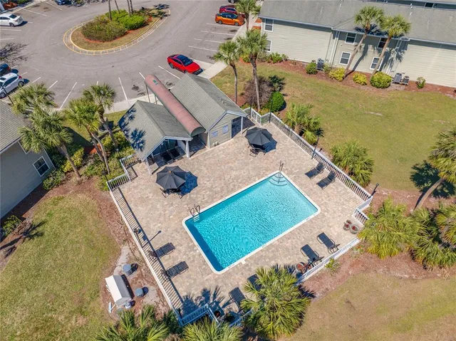 an aerial view of a house with a swimming pool