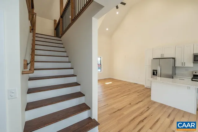 a view of a kitchen from a hallway