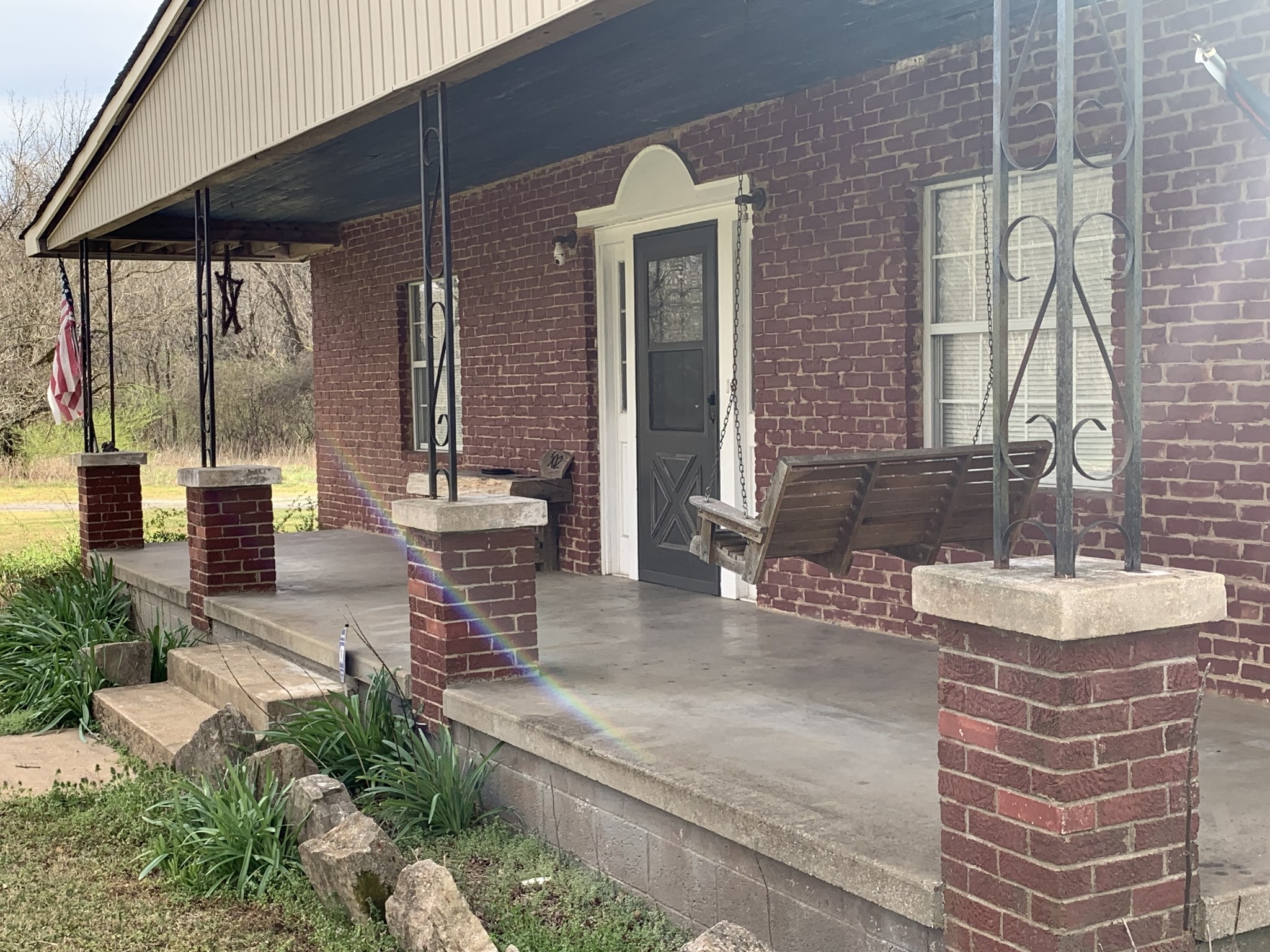a view of a patio with table and chairs and potted plants