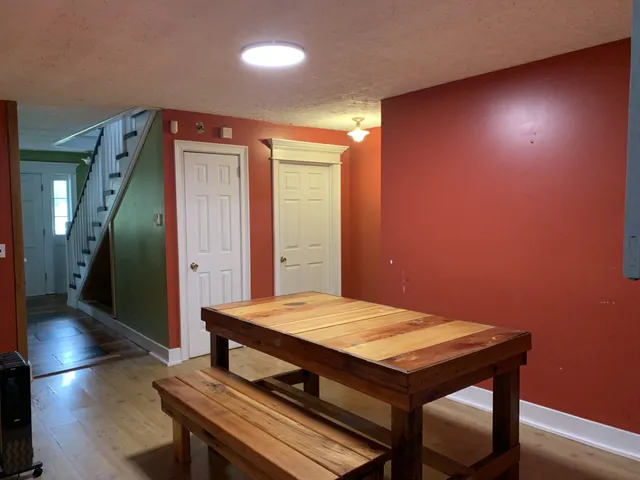 a living room with game table