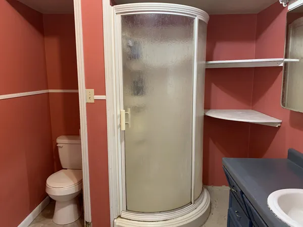 a bathroom with a toilet and a sink