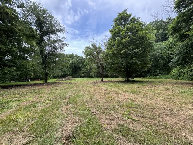 a view of outdoor space with deck and yard