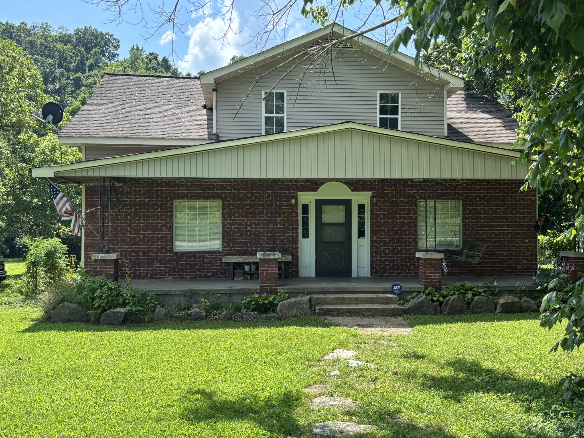 502 Twomey Road Centerville, TN 37033 - Photo 4 of 42 a front view of a house with a yard and garage