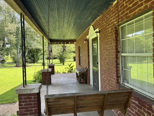 a view of a room with a large window