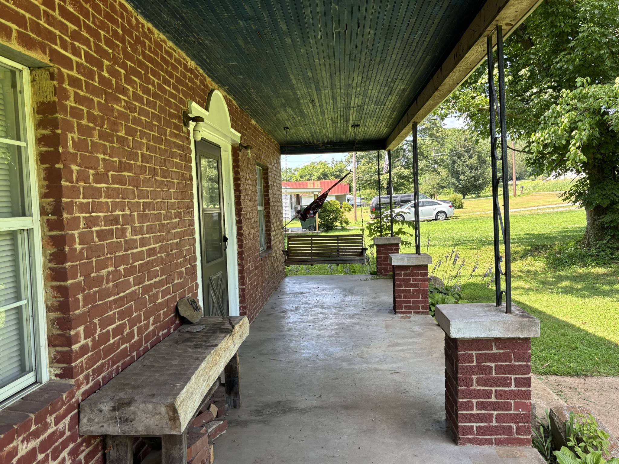 502 Twomey Road Centerville, TN 37033 - Photo 6 of 42 a backyard of a house with a garden and outdoor seating
