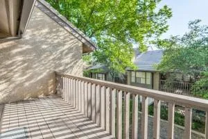 a view of a brick house with a small yard
