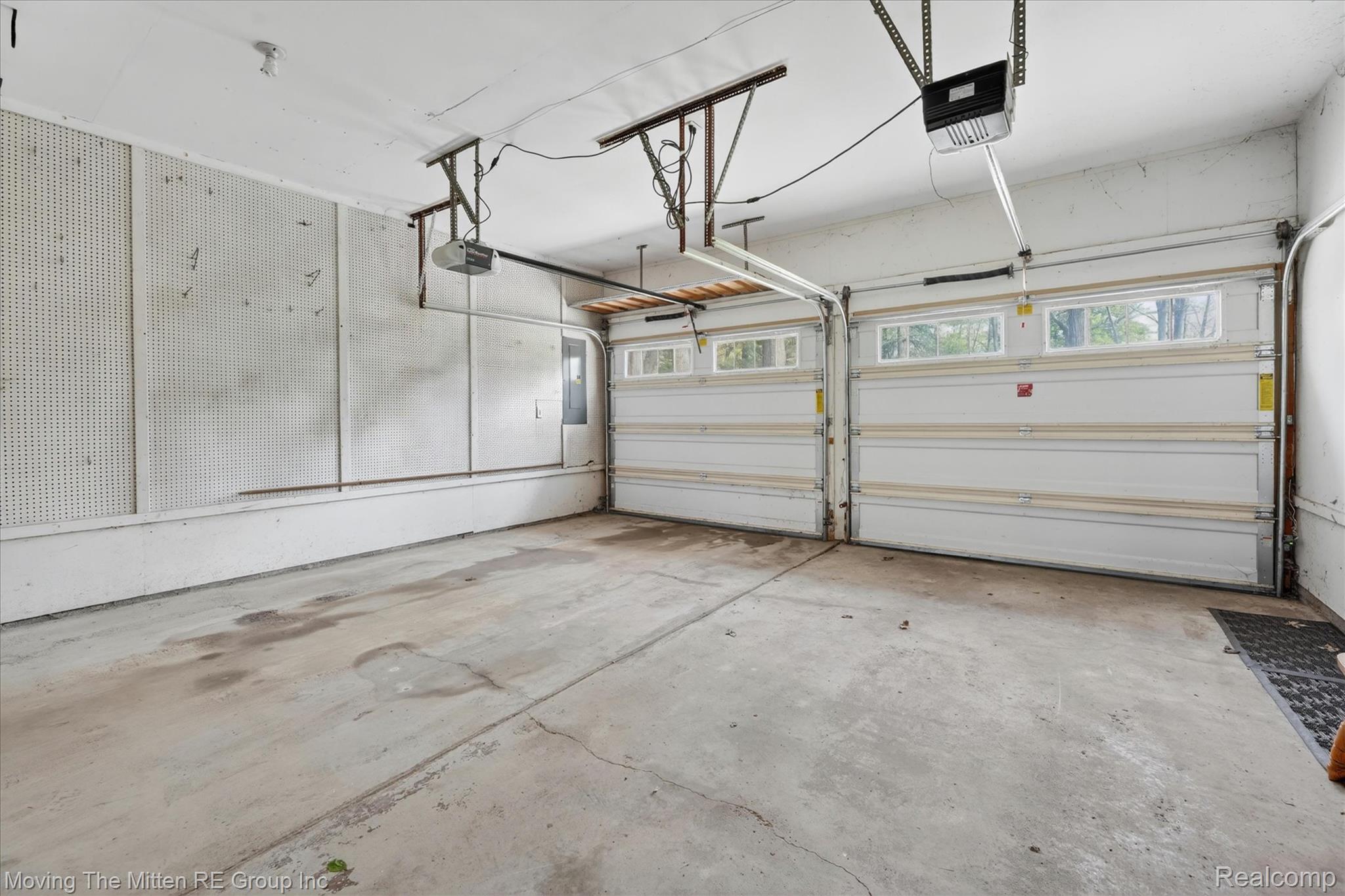 41825 Fret Road Belleville, MI 48111 - Photo 37 of 67 Garage featuring a garage door opener and electric panel