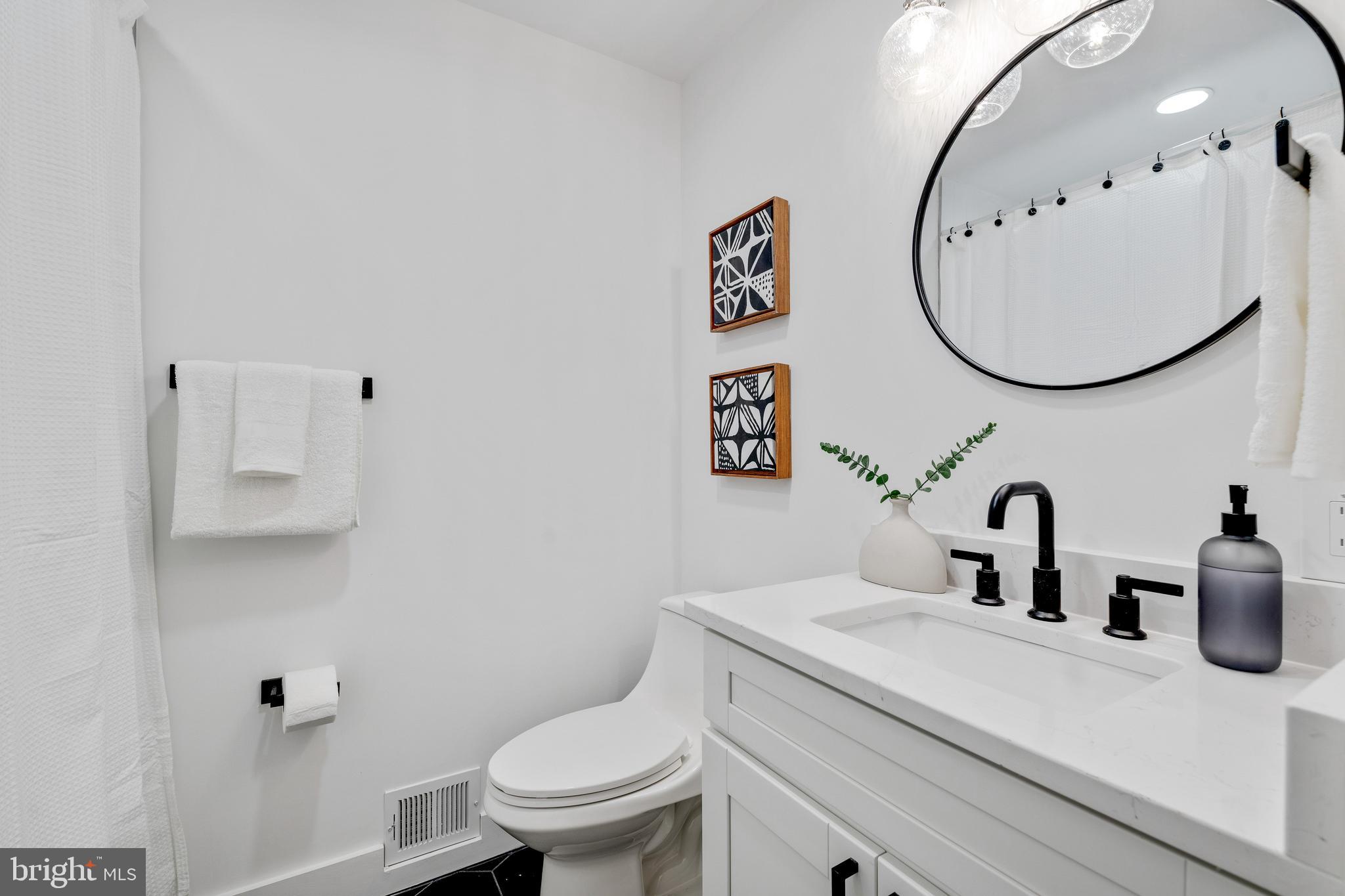 2001 Reuter Road Lutherville-Timonium, MD 21093 - Photo 16 of 38 Hall Bath with Quartz Botanica Countertop