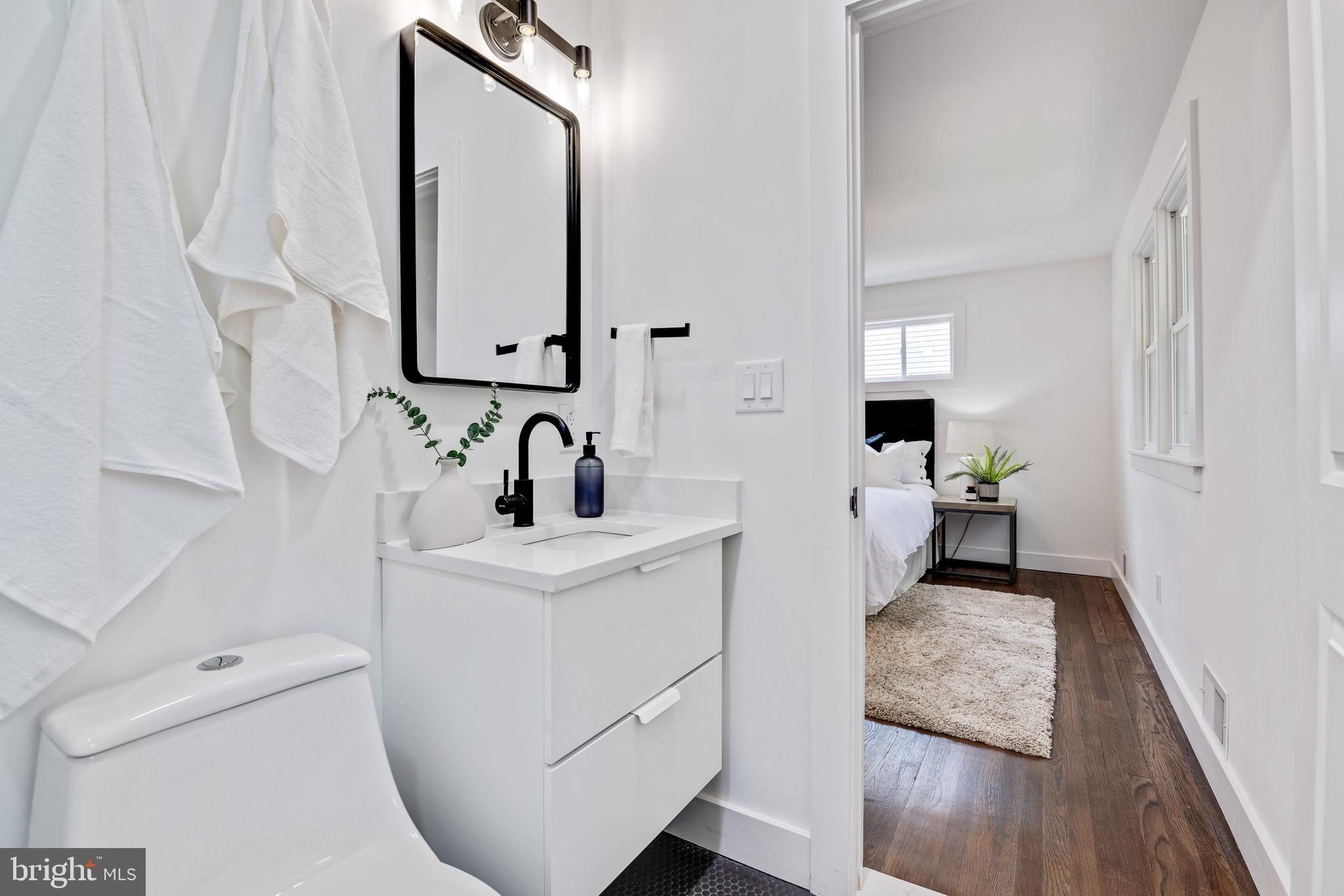 2001 Reuter Road Lutherville-Timonium, MD 21093 - Photo 23 of 38 Owner's Bath with floating vanity & quartz counter