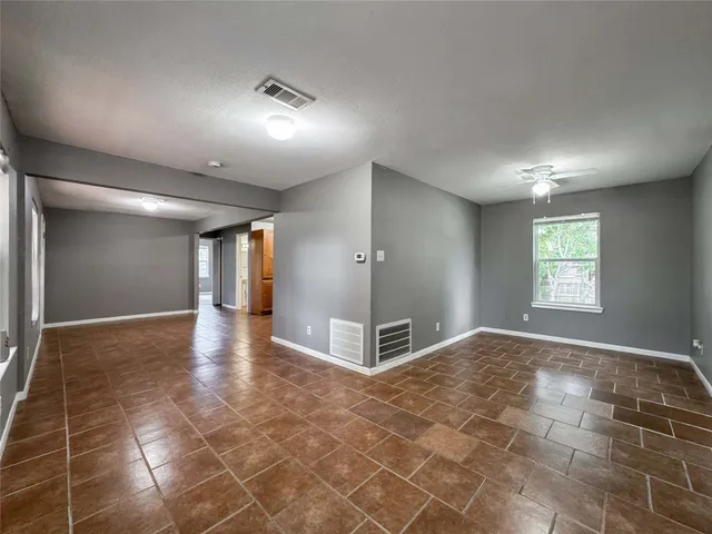 a view of a hallway with a window