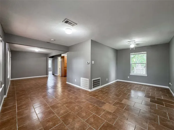 a view of a hallway with a window