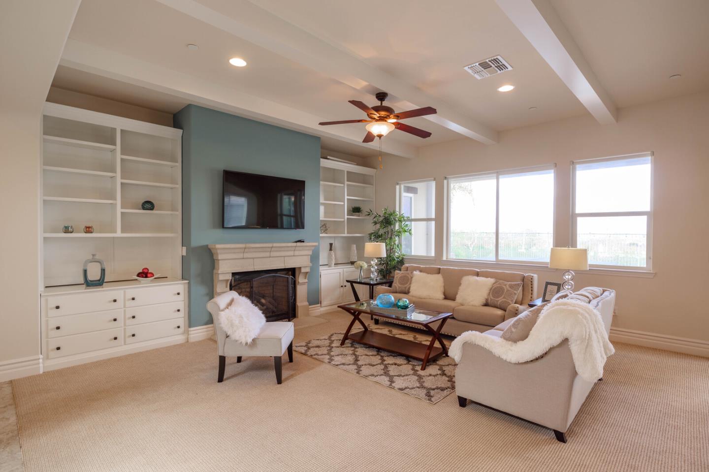 7230 Pitlochry Drive Gilroy, CA 95020 - Photo 14 of 74 a living room with furniture a fireplace and a flat screen tv