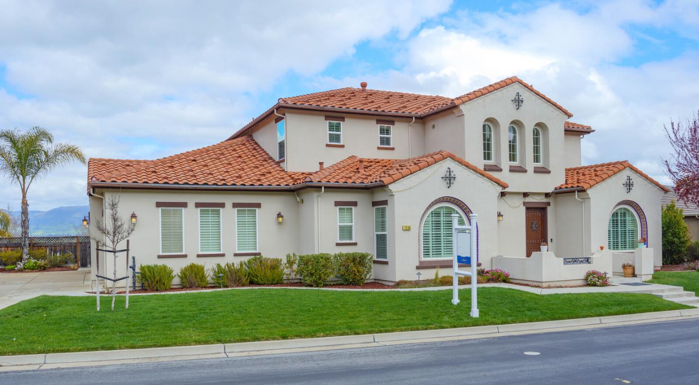 7230 Pitlochry Drive Gilroy, CA 95020 - Photo 2 of 74 a front view of a house with a garden and plants