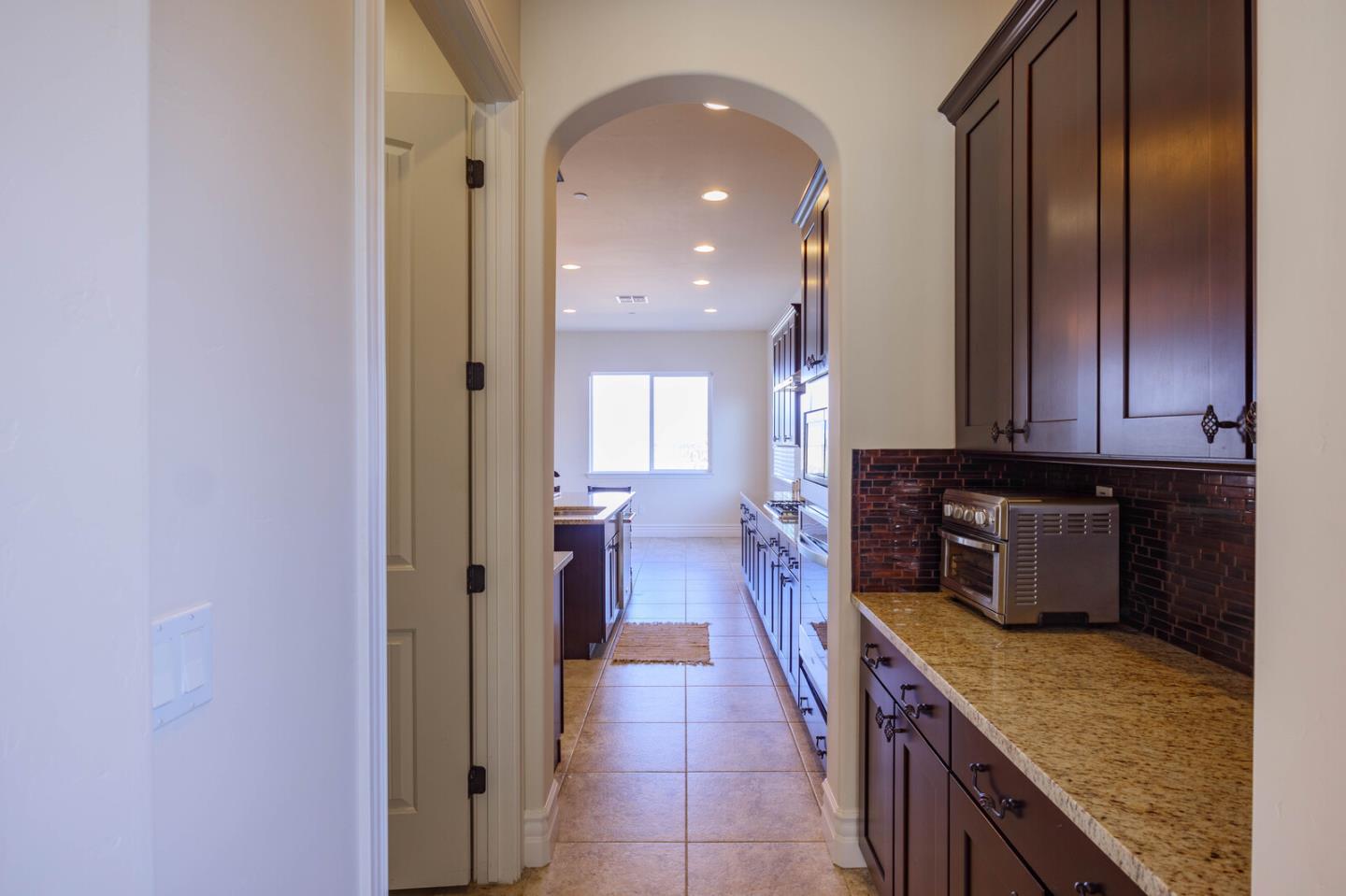 7230 Pitlochry Drive Gilroy, CA 95020 - Photo 23 of 74 a kitchen with a refrigerator and a sink