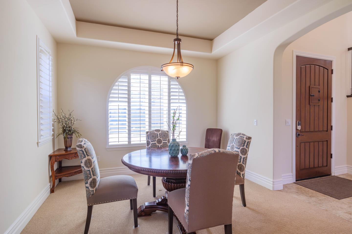 7230 Pitlochry Drive Gilroy, CA 95020 - Photo 26 of 74 a dining room with furniture a chandelier and window