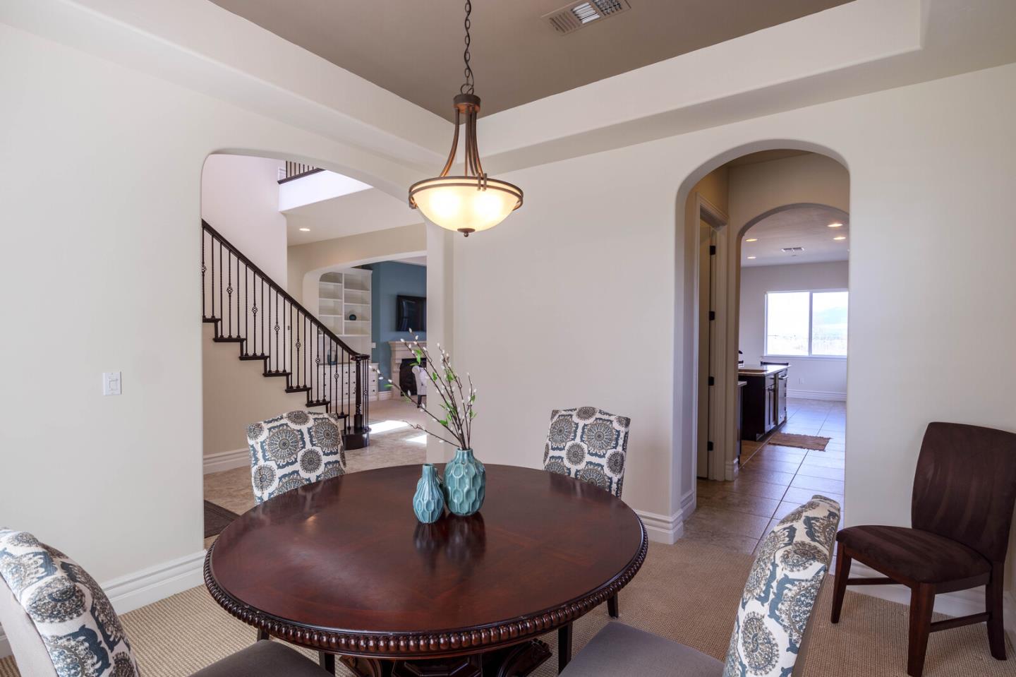 7230 Pitlochry Drive Gilroy, CA 95020 - Photo 27 of 74 a view of a livingroom with furniture wooden floor and kitchen view