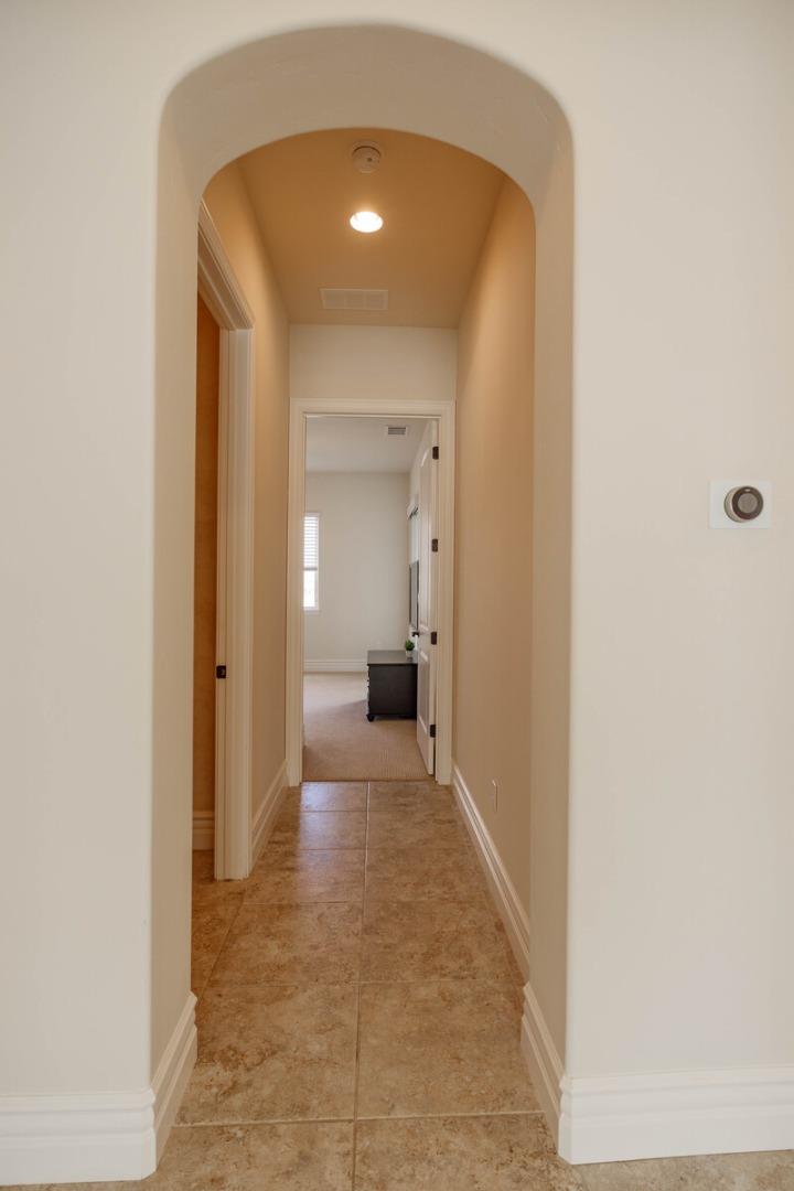 7230 Pitlochry Drive Gilroy, CA 95020 - Photo 30 of 74 a view of a hallway with wooden shelves