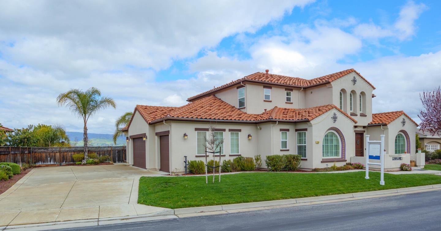 7230 Pitlochry Drive Gilroy, CA 95020 - Photo 3 of 74 a front view of a house with a garden and plants
