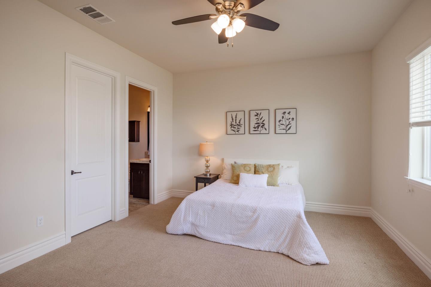 7230 Pitlochry Drive Gilroy, CA 95020 - Photo 33 of 74 a bedroom with a bed and a chandelier