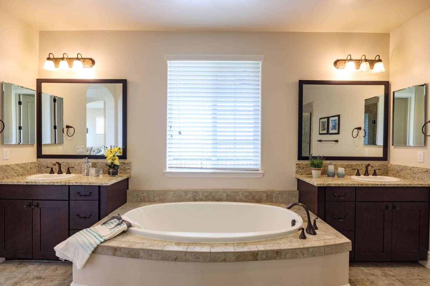 7230 Pitlochry Drive Gilroy, CA 95020 - Photo 52 of 74 a bathroom with a tub sink and mirror