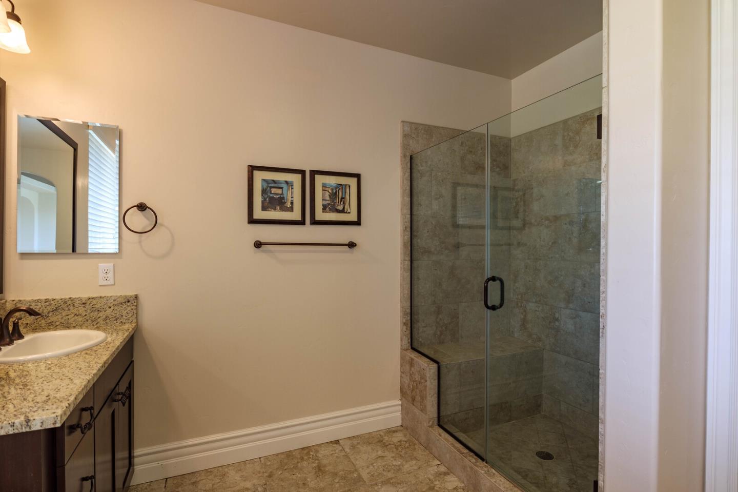 7230 Pitlochry Drive Gilroy, CA 95020 - Photo 53 of 74 a bathroom with a granite countertop sink a shower a mirror and a sink