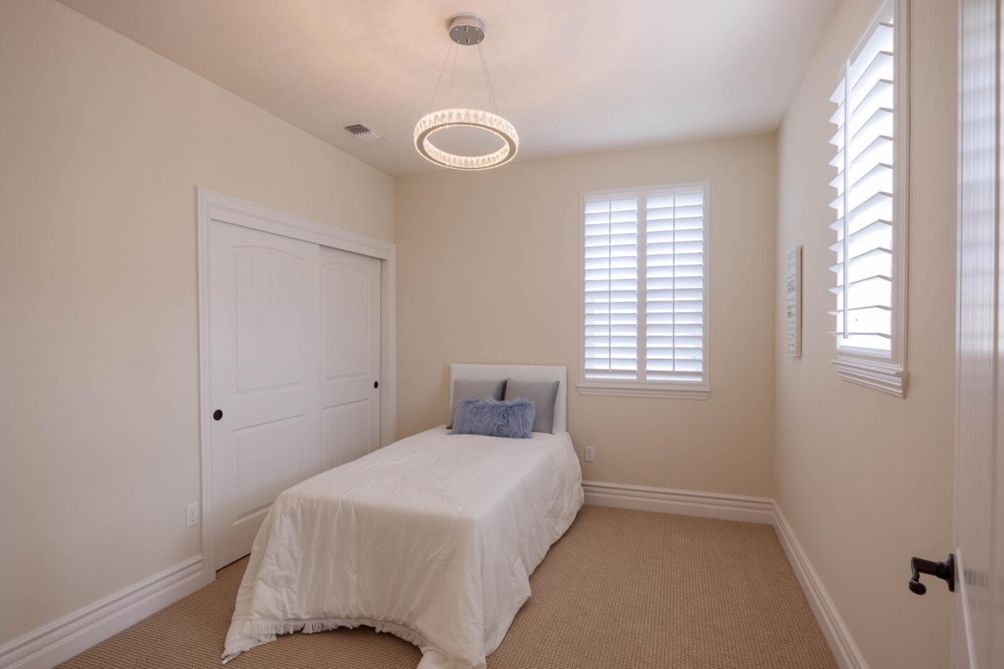 7230 Pitlochry Drive Gilroy, CA 95020 - Photo 58 of 74 a bedroom with a bed and a window