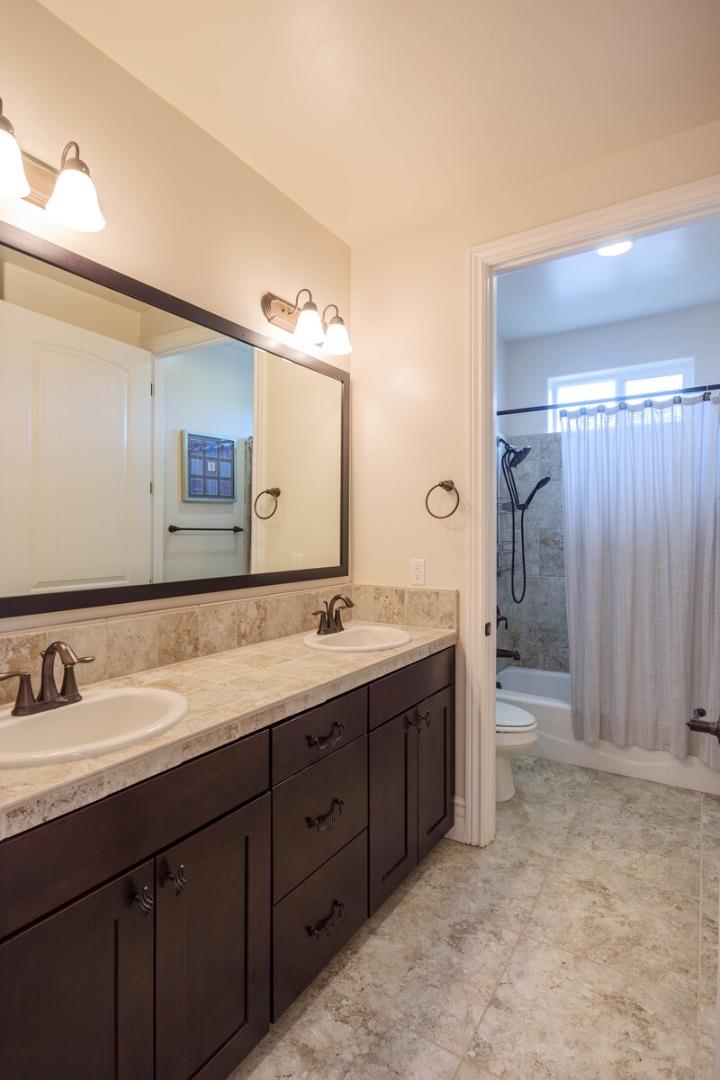 7230 Pitlochry Drive Gilroy, CA 95020 - Photo 60 of 74 a bathroom with a double vanity sink and a mirror