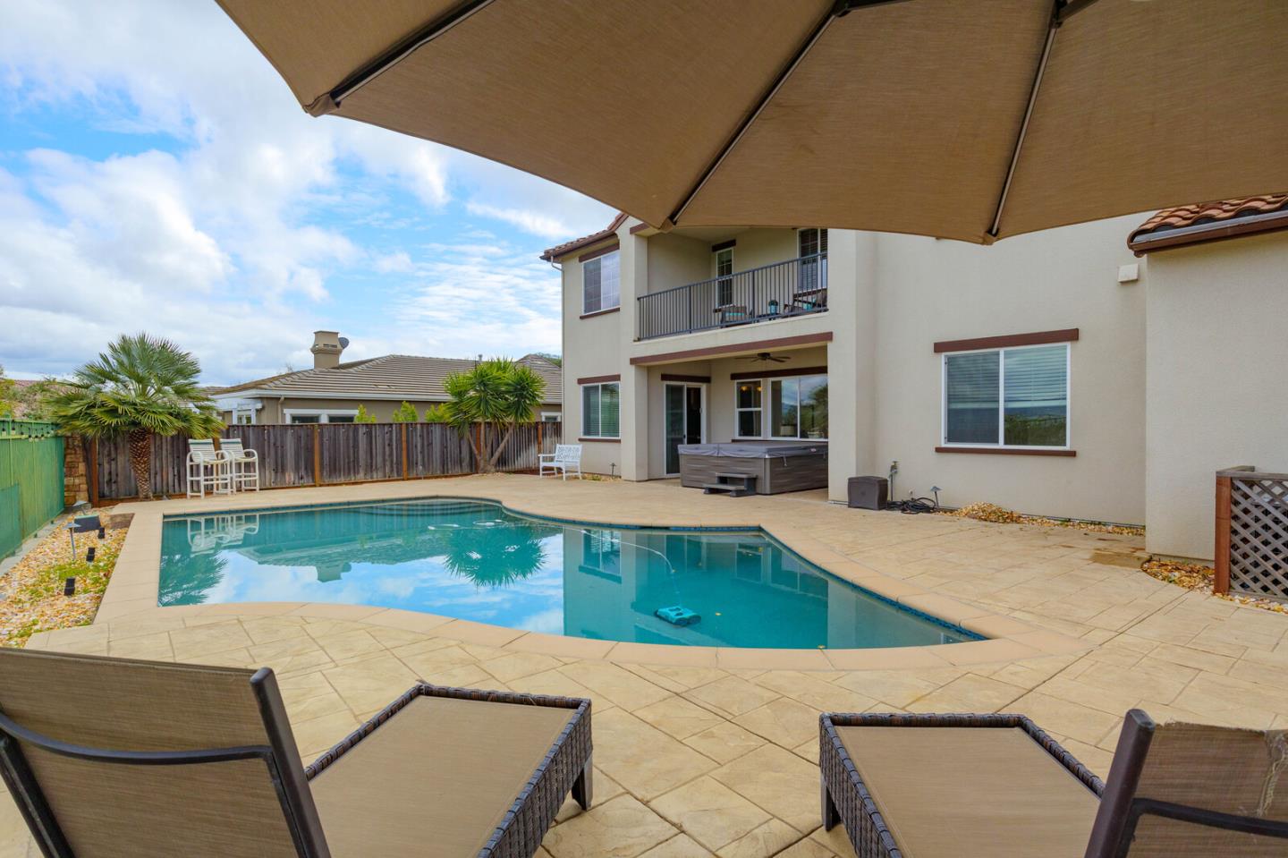 7230 Pitlochry Drive Gilroy, CA 95020 - Photo 68 of 74 a view of a house with pool and chairs