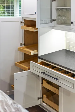 a kitchen with a stove a sink and a refrigerator
