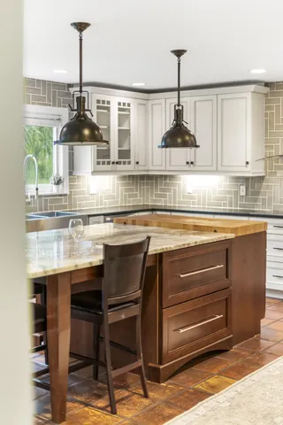 a view of a dining room kitchen and windows