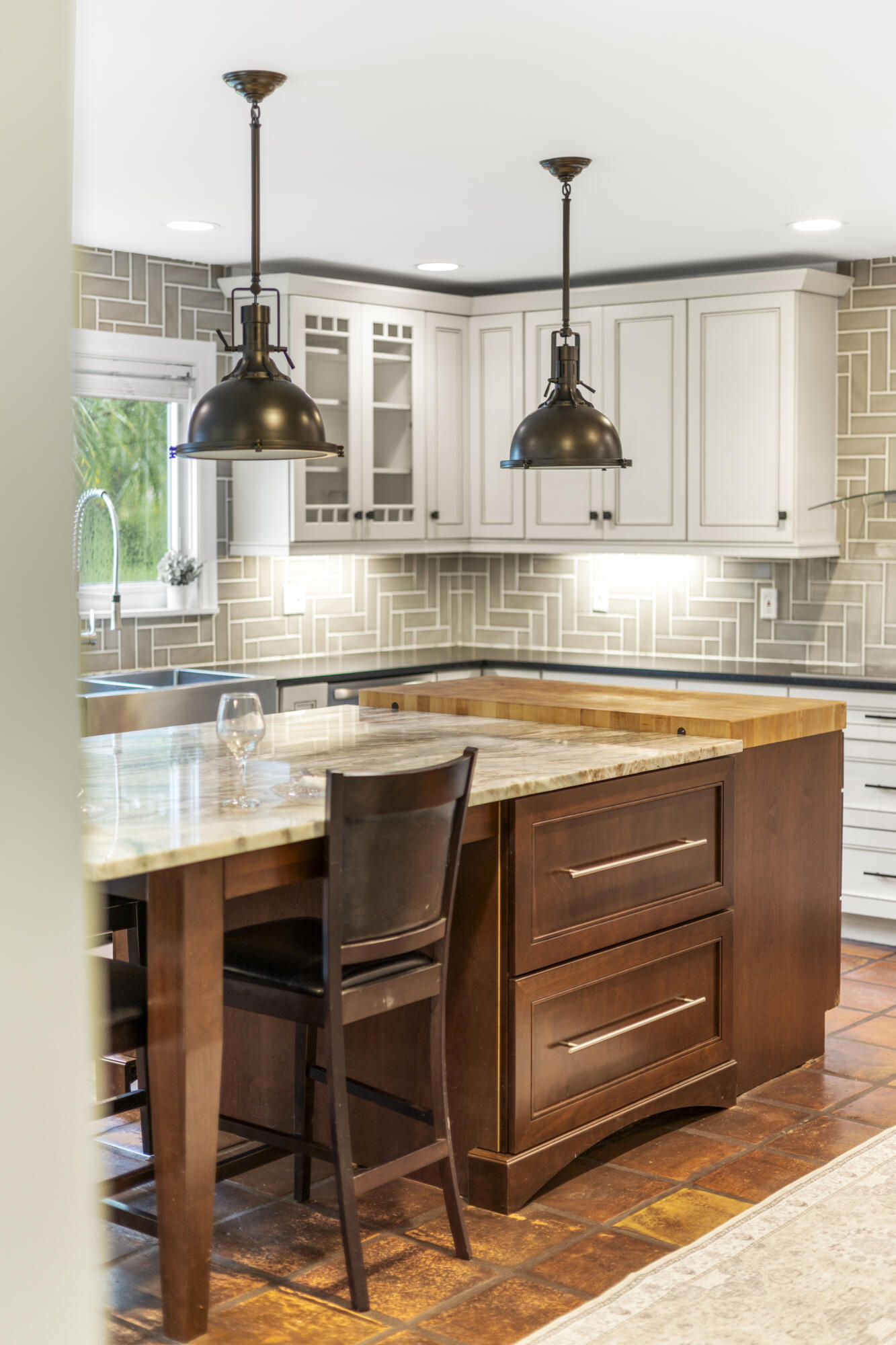 6595 Wood Lake Road Jupiter, FL 33458 - Photo 21 of 54 a kitchen with stainless steel appliances granite countertop a sink a stove and a wooden floors